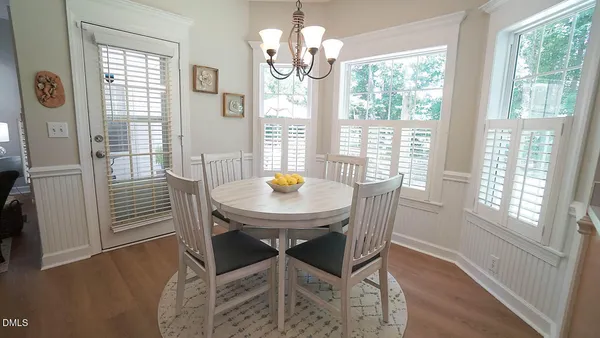 a view of a dining room with furniture window and outside view
