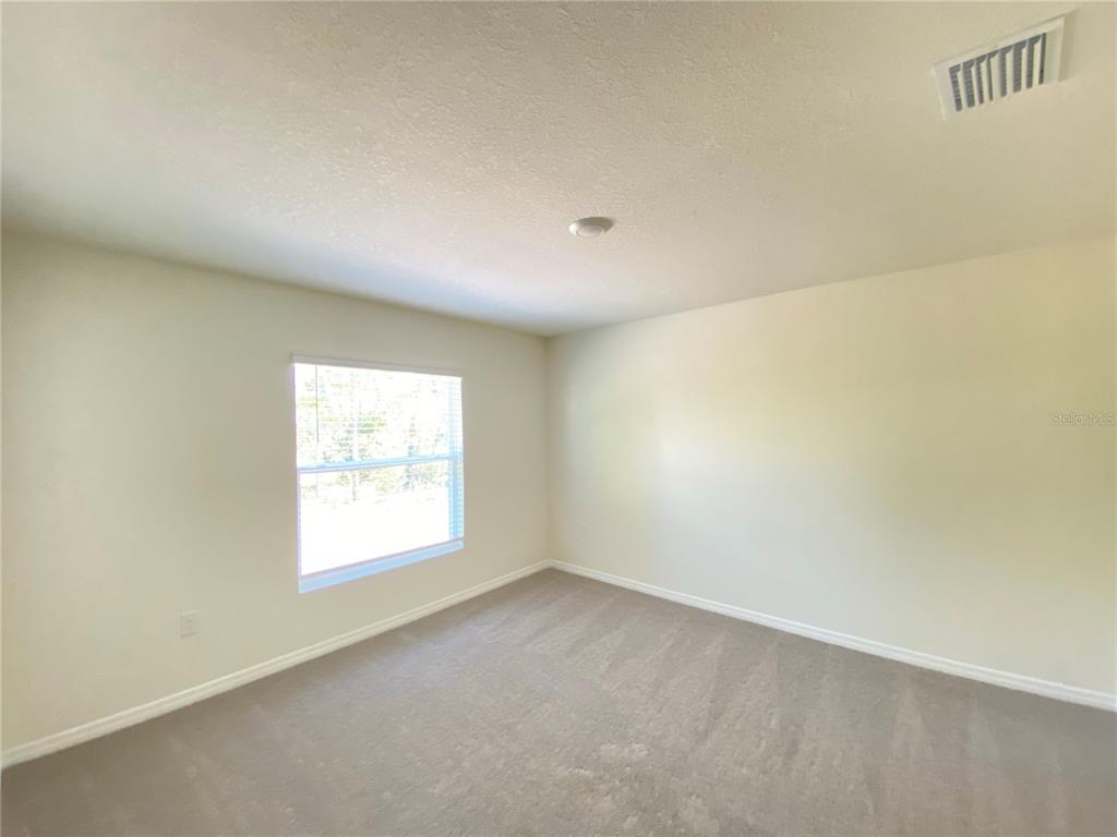 492 Hickory Course Loop Ocala, FL 34472 - Photo 24 of 28 an empty room with a window