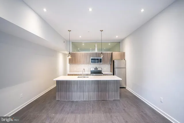 a view of kitchen with wooden floor