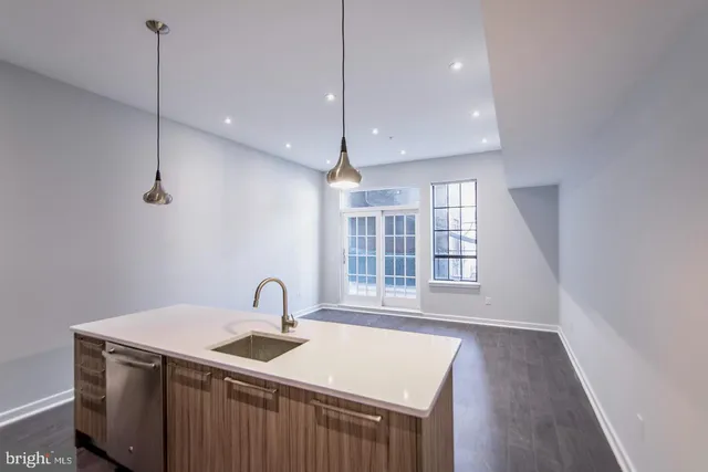 a kitchen with sink and window