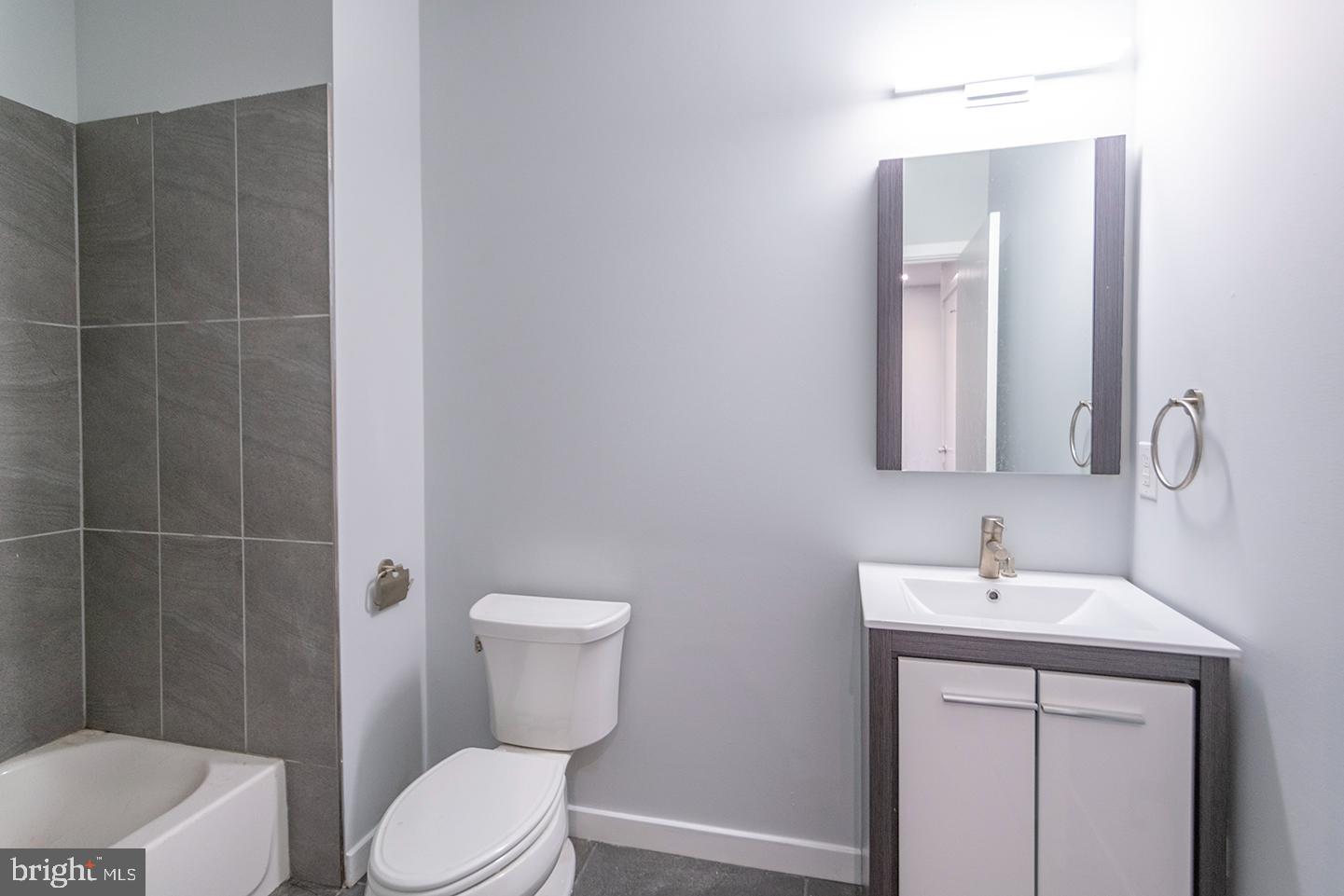 412 South 13th Street, Unit 212 Philadelphia, PA 19147 - Photo 7 of 16 a bathroom with a sink a toilet and shower