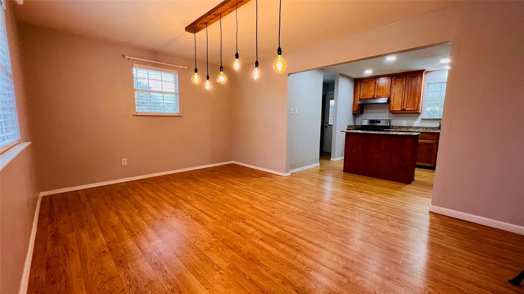 7301 Fishtrap Road Cross Roads, TX 76227 - Photo 15 of 40 a view of a kitchen with a dishwasher and wooden floor