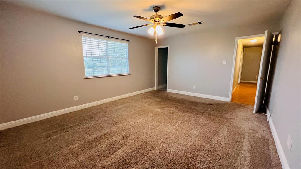 7301 Fishtrap Road Cross Roads, TX 76227 - Photo 20 of 40 an empty room with windows and fan