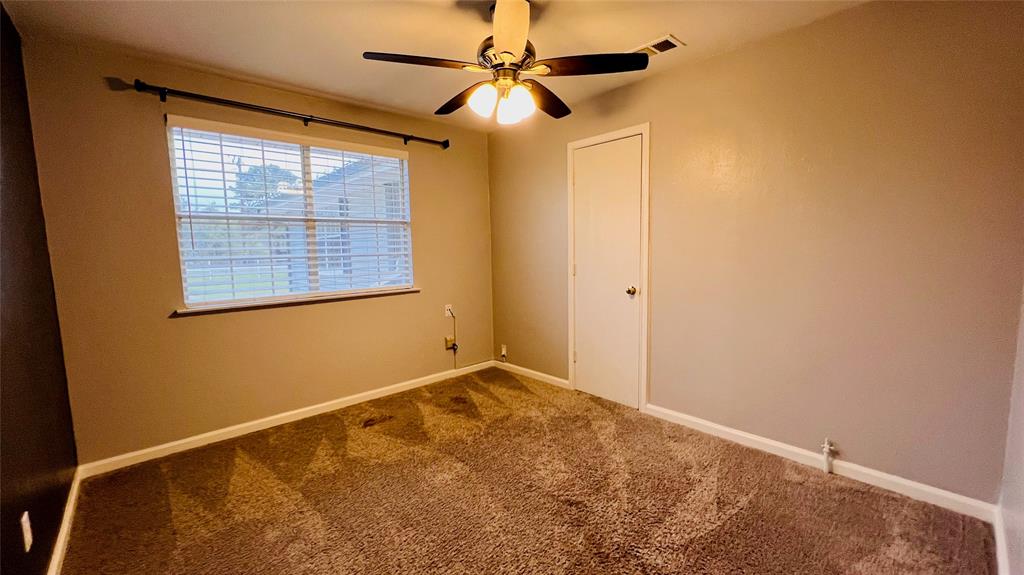 7301 Fishtrap Road Cross Roads, TX 76227 - Photo 23 of 40 an empty room with a window and a fan