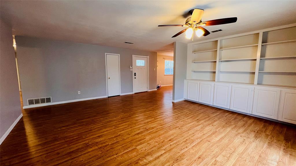 7301 Fishtrap Road Cross Roads, TX 76227 - Photo 27 of 40 a view of an empty room with a window and wooden floor