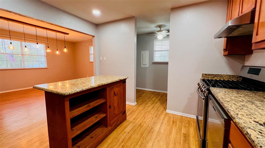 7301 Fishtrap Road Cross Roads, TX 76227 - Photo 29 of 40 a kitchen with a stove and a wooden floor