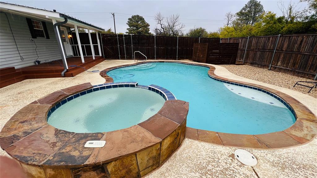 7301 Fishtrap Road Cross Roads, TX 76227 - Photo 38 of 40 a view of a swimming pool with a yard and wooden fence