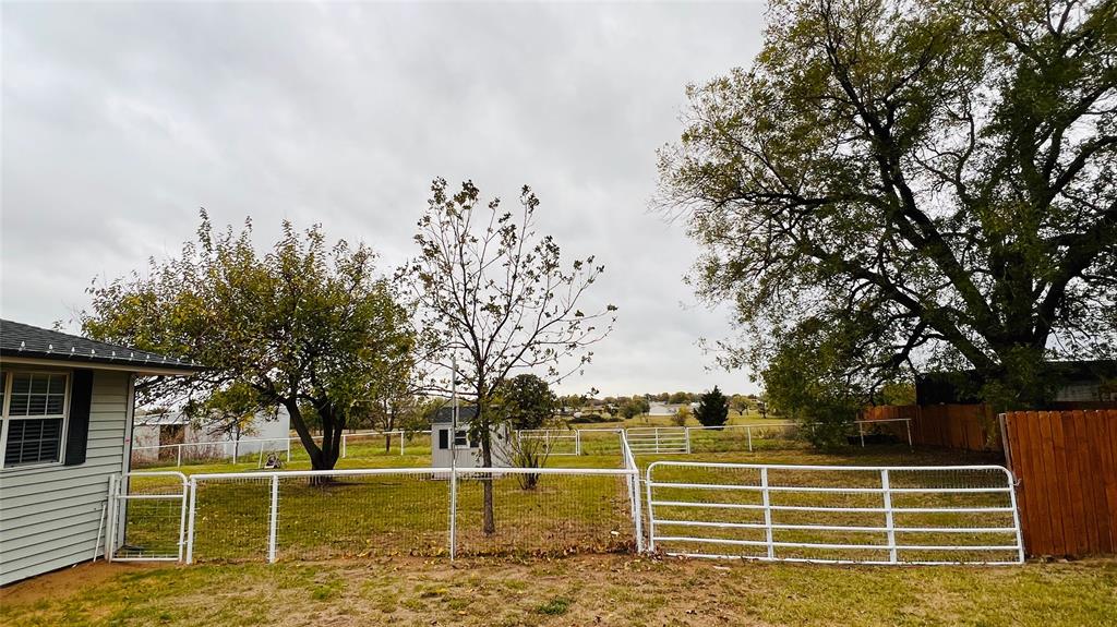 7301 Fishtrap Road Cross Roads, TX 76227 - Photo 6 of 40 a view of a yard with wooden fence