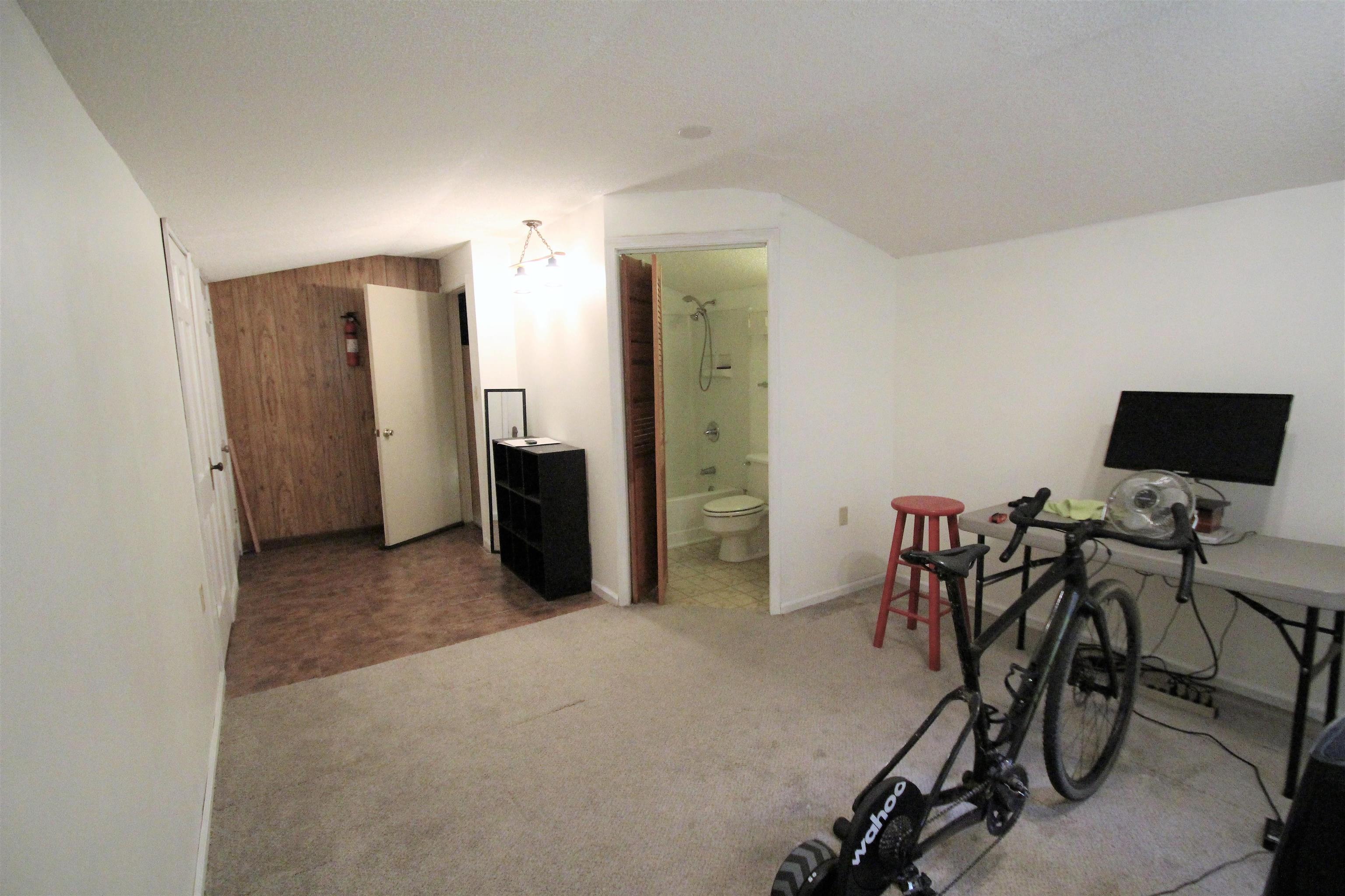 1156 Hayne Road Memphis, TN 38119 - Photo 15 of 25 a view of a livingroom with furniture and a flat screen tv