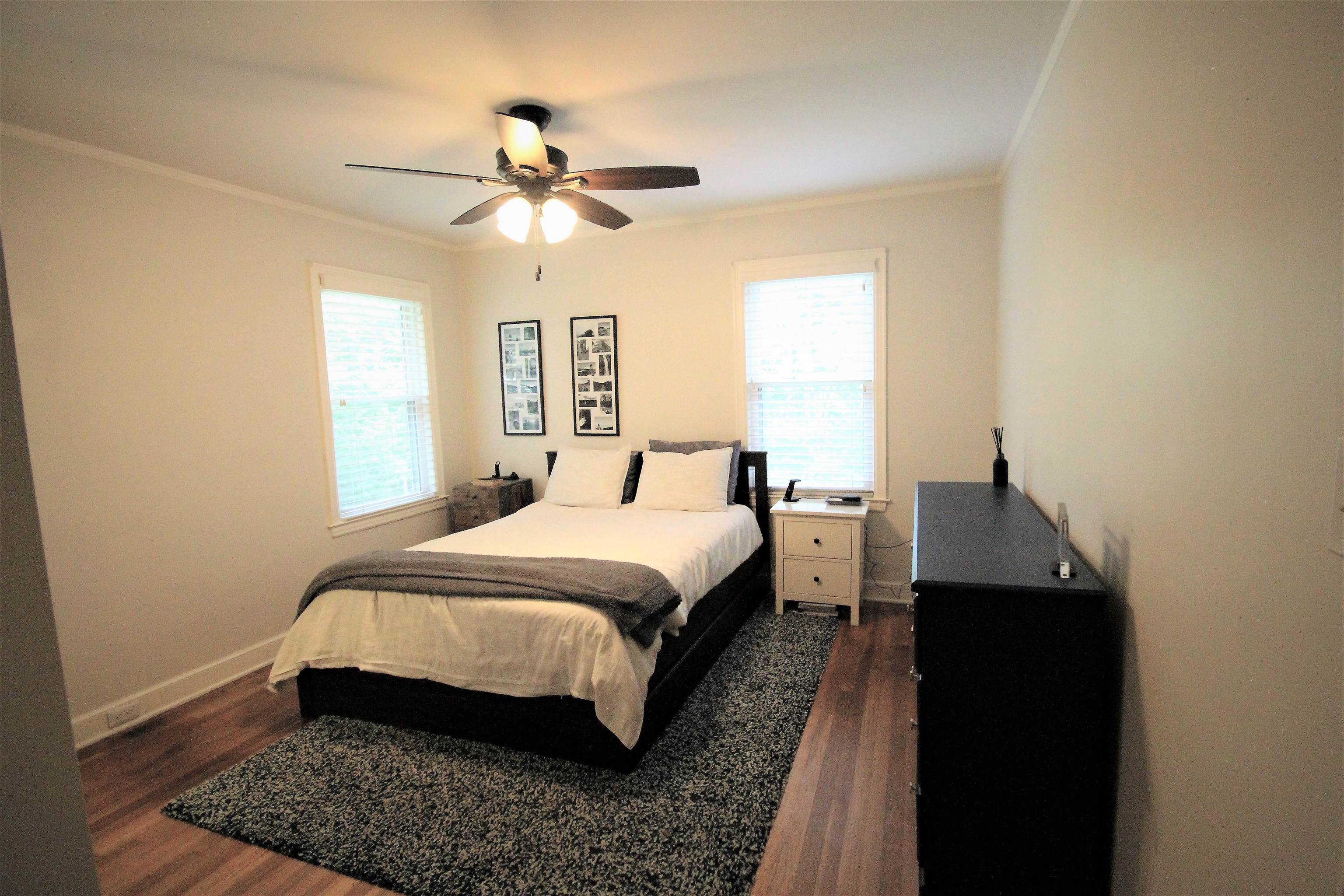 1156 Hayne Road Memphis, TN 38119 - Photo 18 of 25 a bedroom with a bed and wooden floor