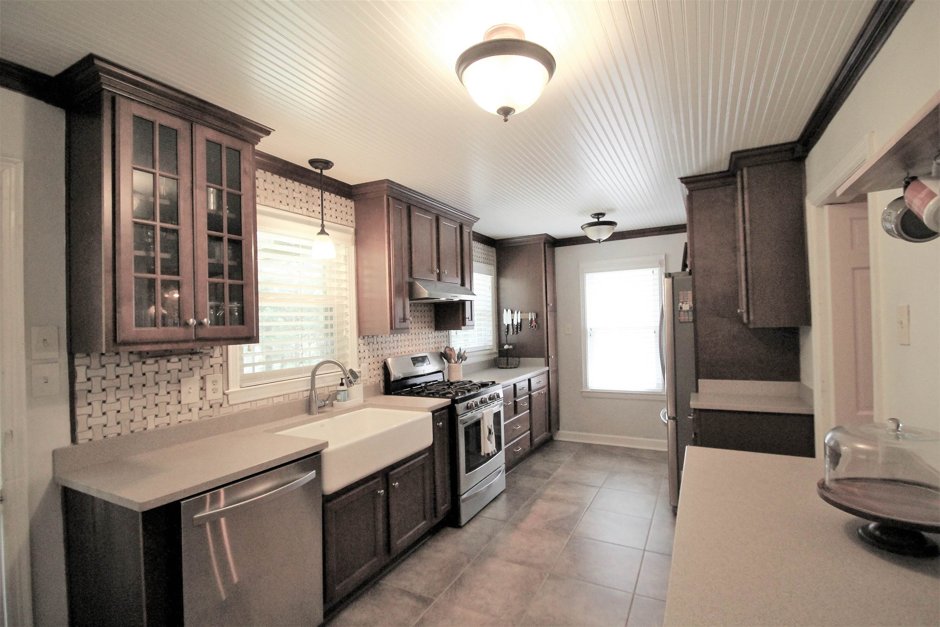 1156 Hayne Road Memphis, TN 38119 - Photo 2 of 25 a kitchen with a sink and a stove top oven