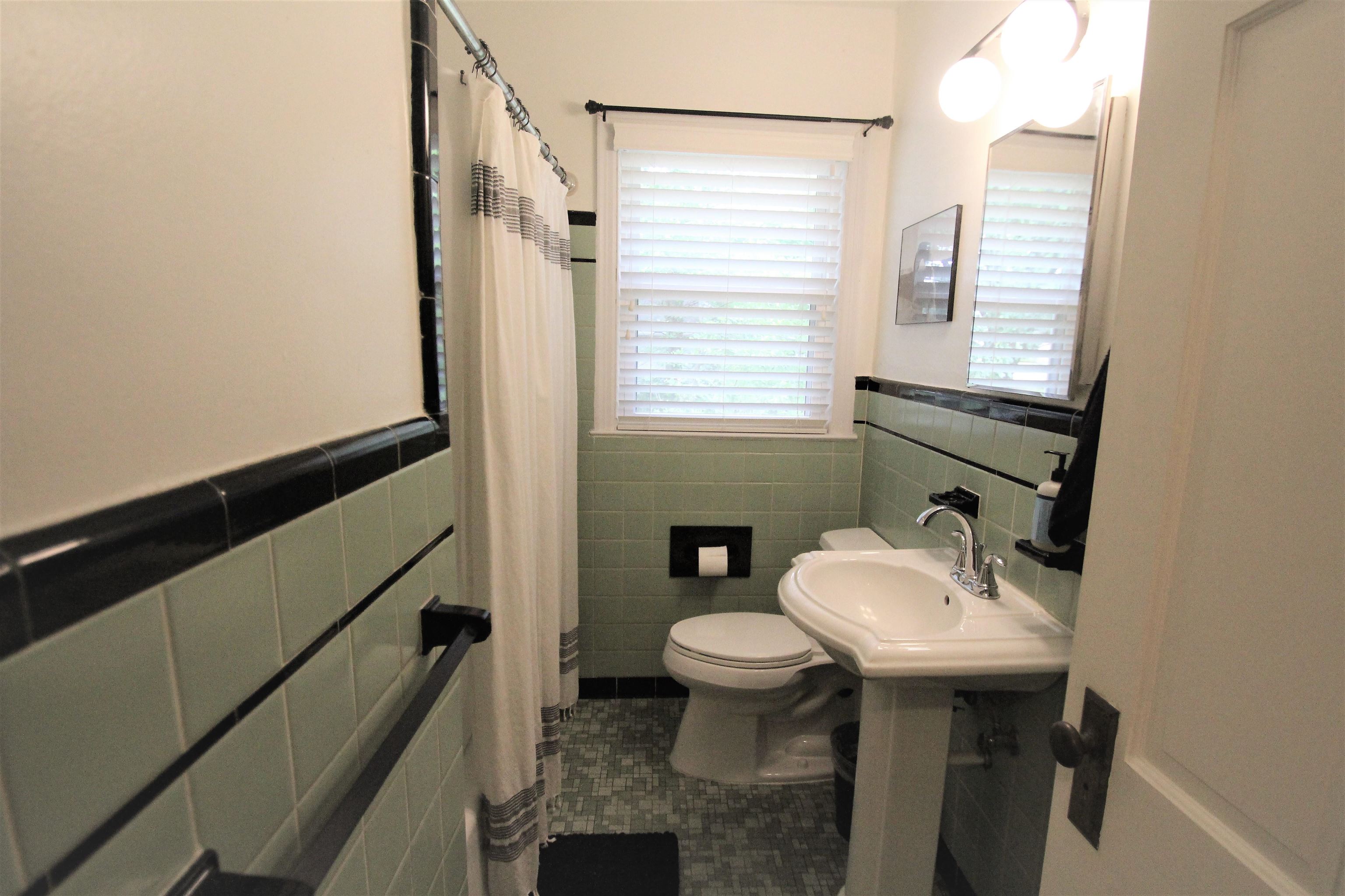 1156 Hayne Road Memphis, TN 38119 - Photo 8 of 25 a bathroom with a sink toilet and mirror