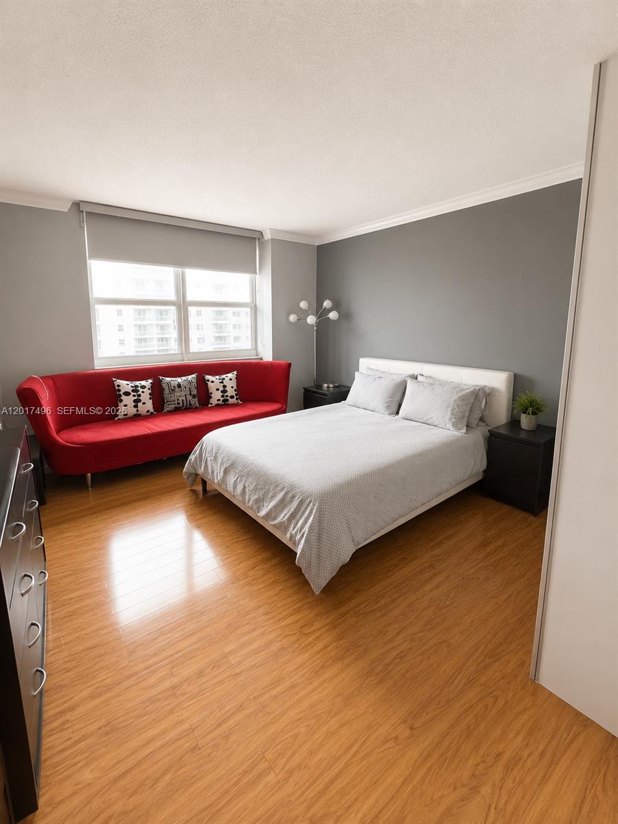 Brickell Miami, FL 33131 - Photo 14 of 19 a bedroom with a bed and window