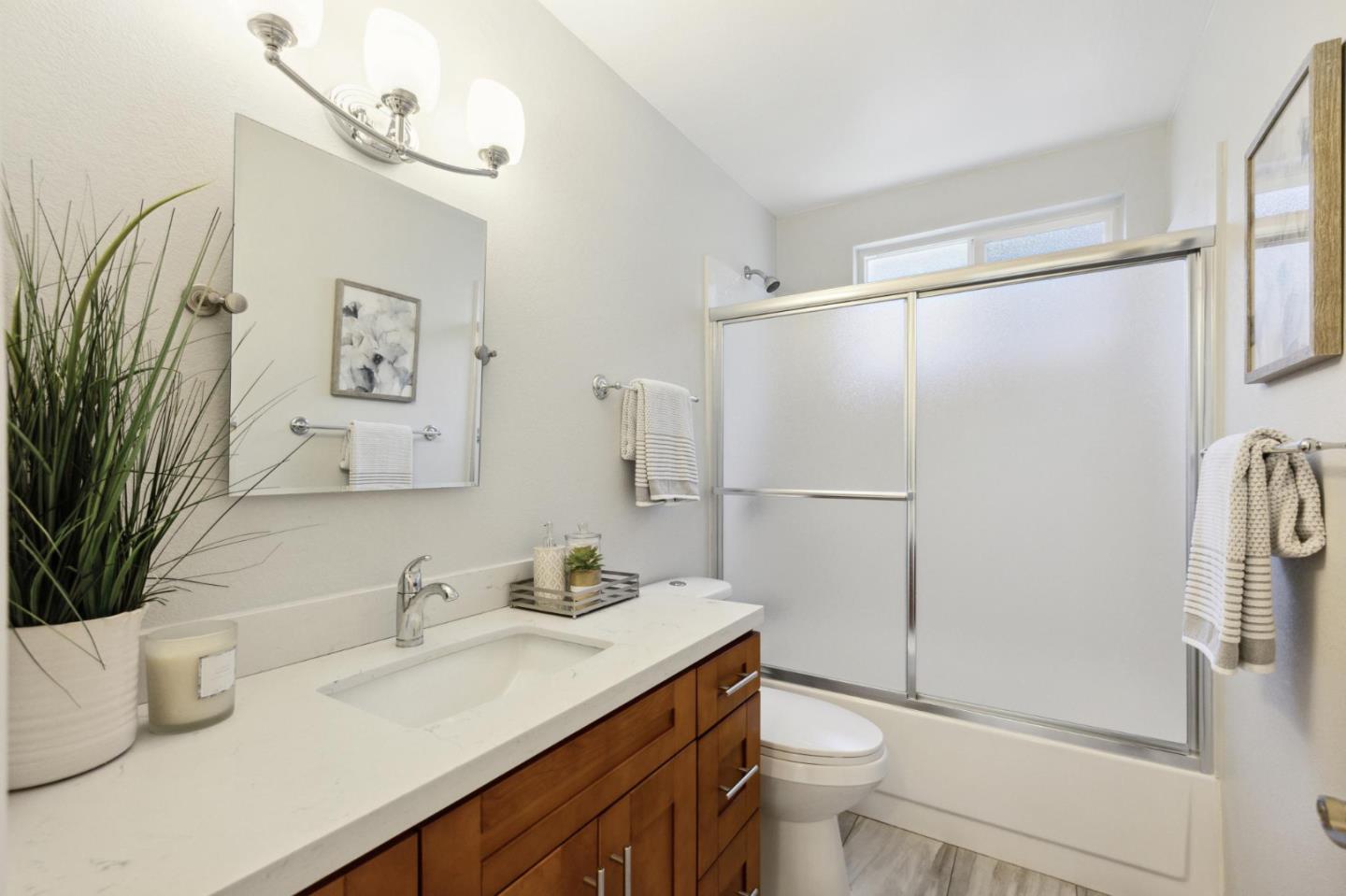 3230 Longview Drive San Bruno, CA 94066 - Photo 15 of 23 a bathroom with a granite countertop sink toilet and shower
