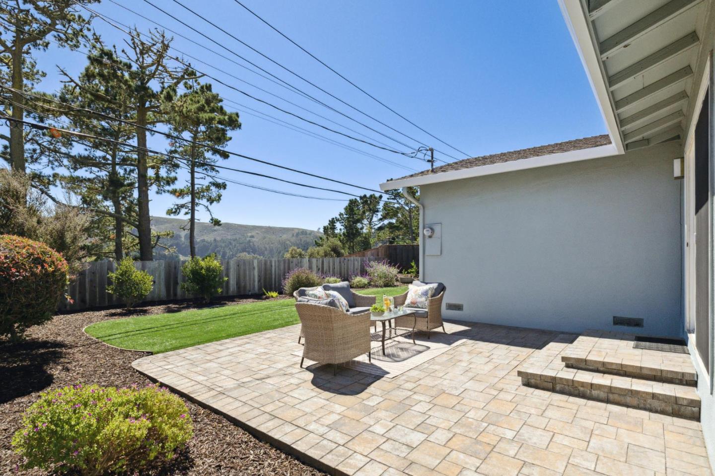 3230 Longview Drive San Bruno, CA 94066 - Photo 16 of 23 a view of a white house with a yard and sitting area