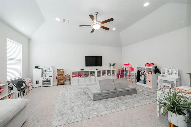 a bathroom with a granite countertop sink a toilet and a mirror