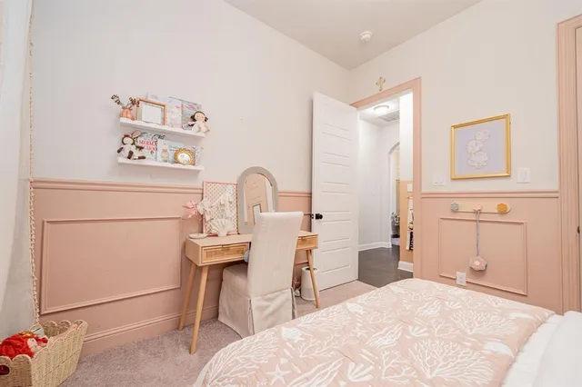 a bedroom with a bed and a couch