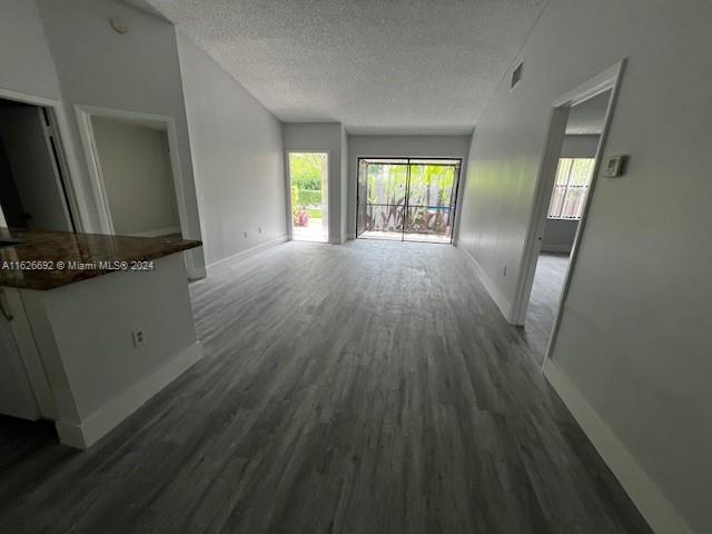 2622 North Nob Hill Road, Unit 2622 Sunrise, FL 33322 - Photo 6 of 16 an empty room with wooden floor and windows