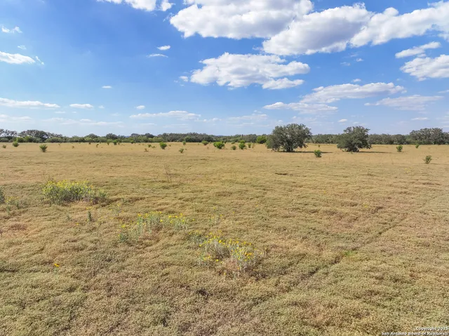 a view of a field with an outdoor space