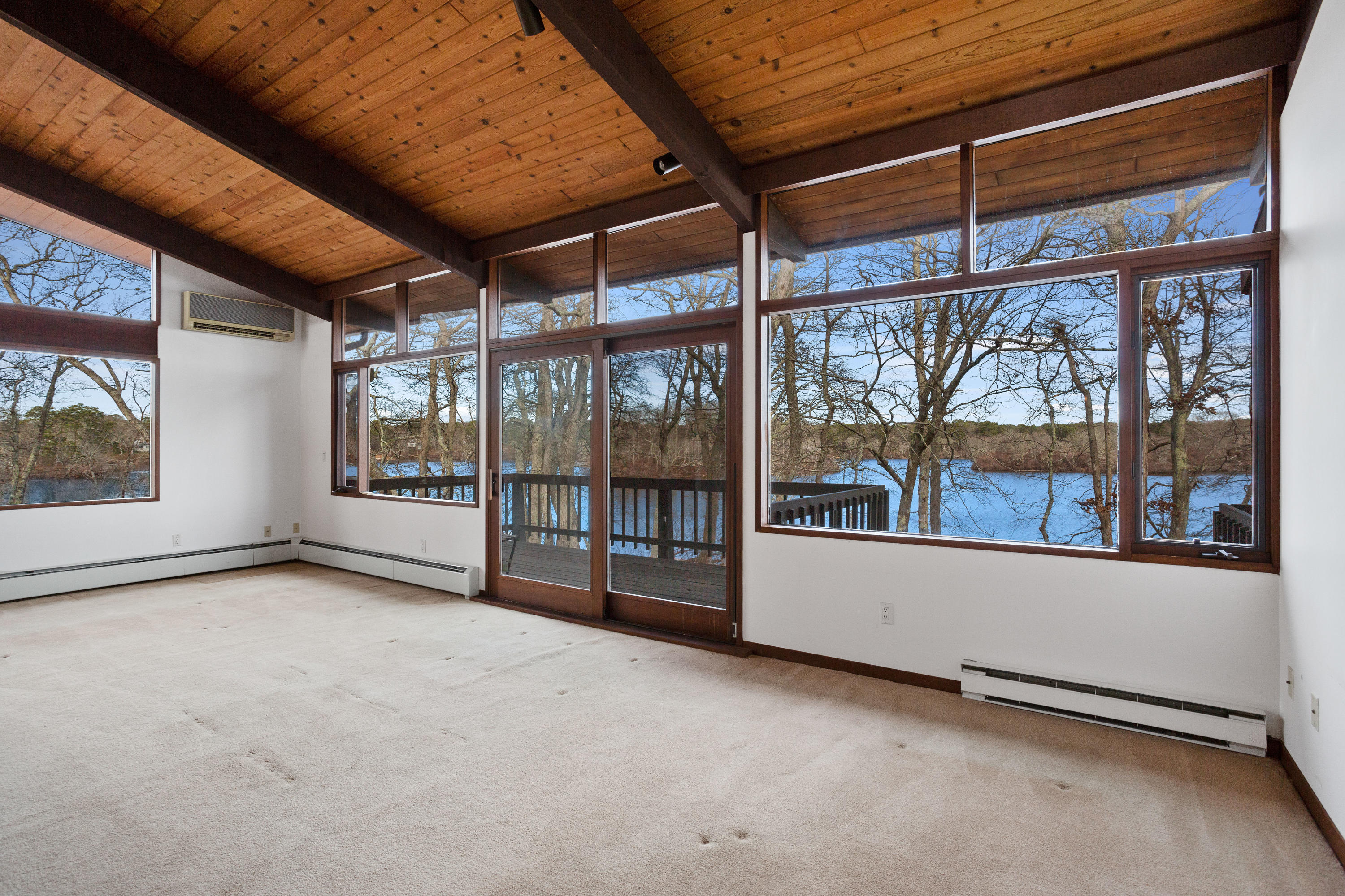 278 Huckins Neck Road Centerville, MA 02601 - Photo 11 of 52 a view of an empty room with a window