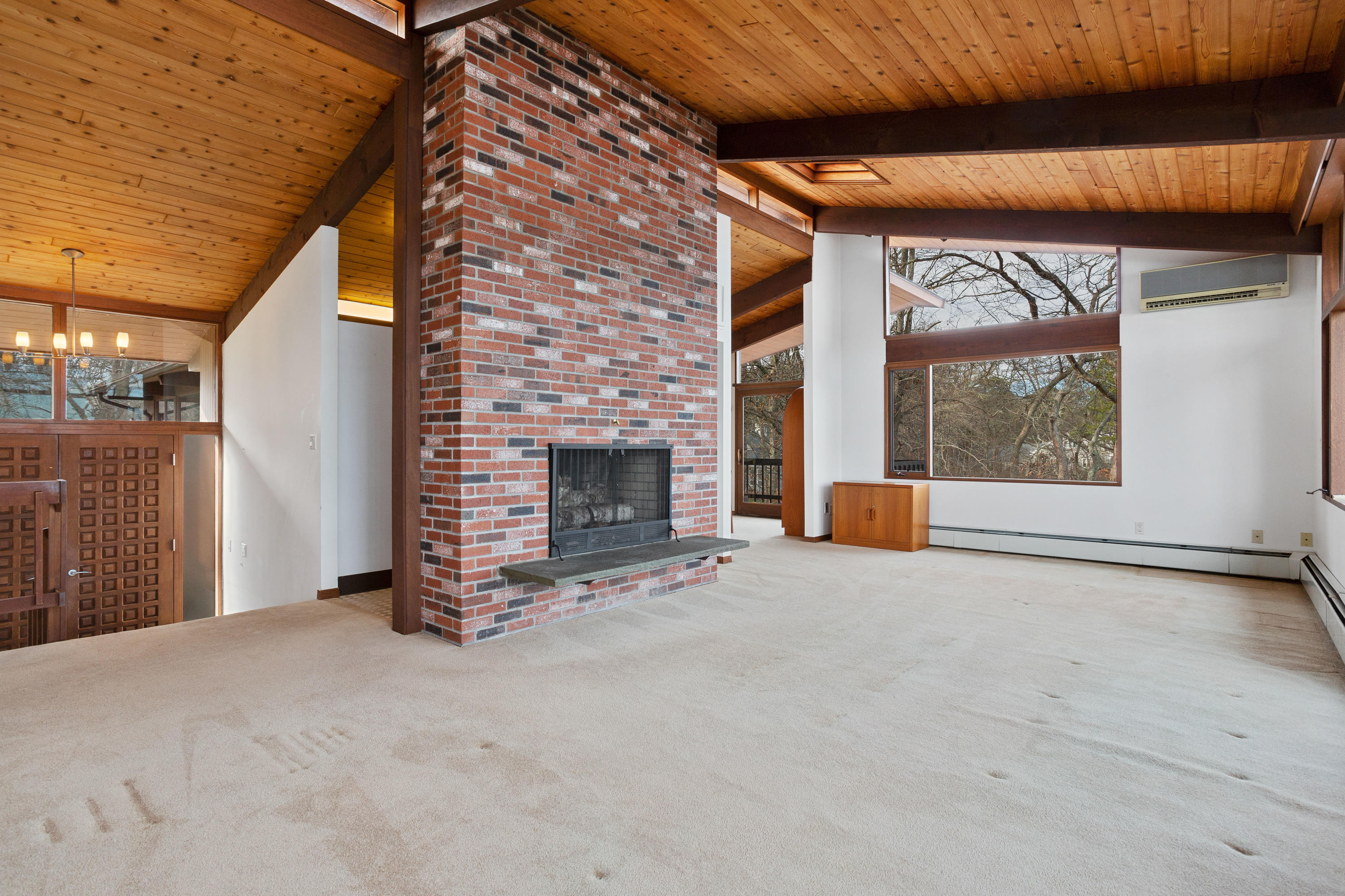 278 Huckins Neck Road Centerville, MA 02601 - Photo 15 of 52 a view of an empty room with a fireplace