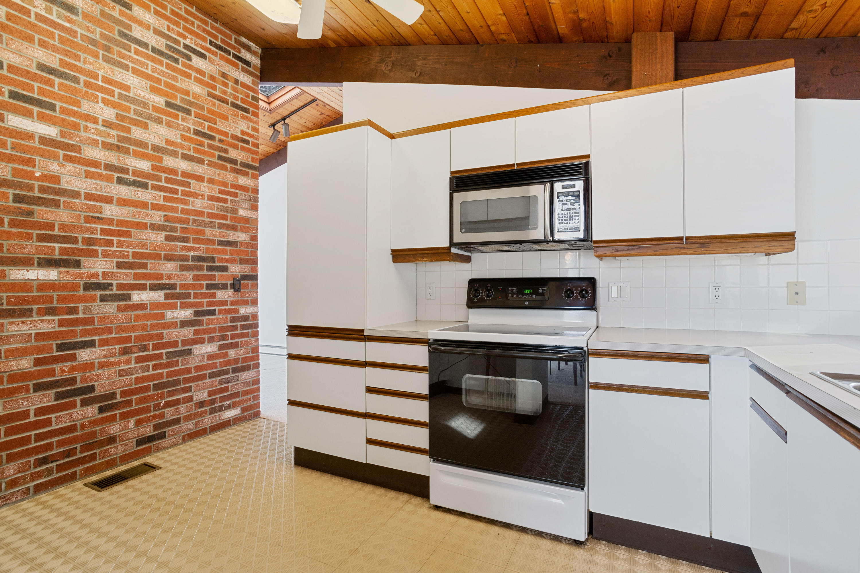 278 Huckins Neck Road Centerville, MA 02601 - Photo 20 of 52 a kitchen with stainless steel appliances a stove and a microwave