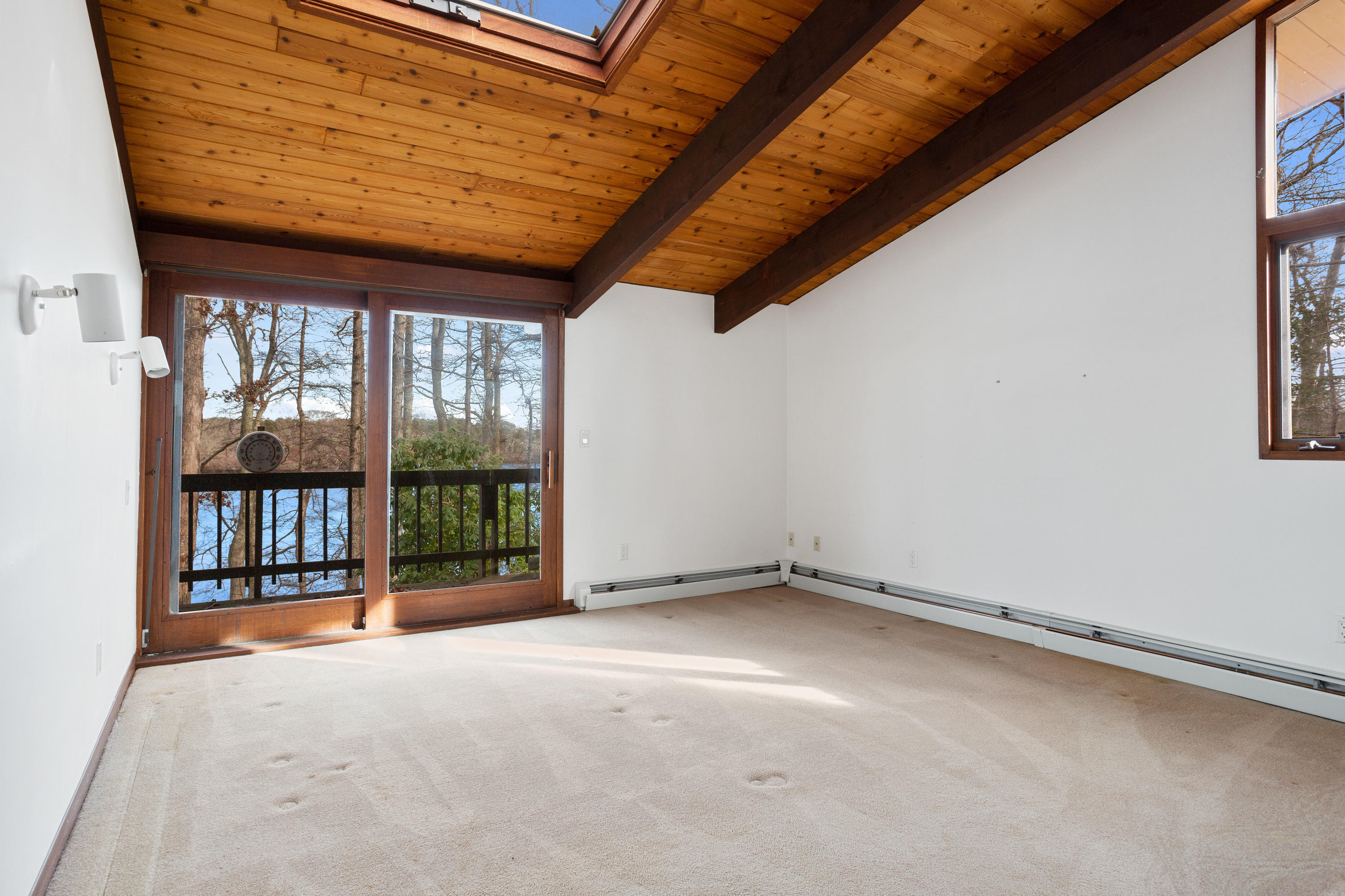 278 Huckins Neck Road Centerville, MA 02601 - Photo 27 of 52 a view of an empty room with a balcony