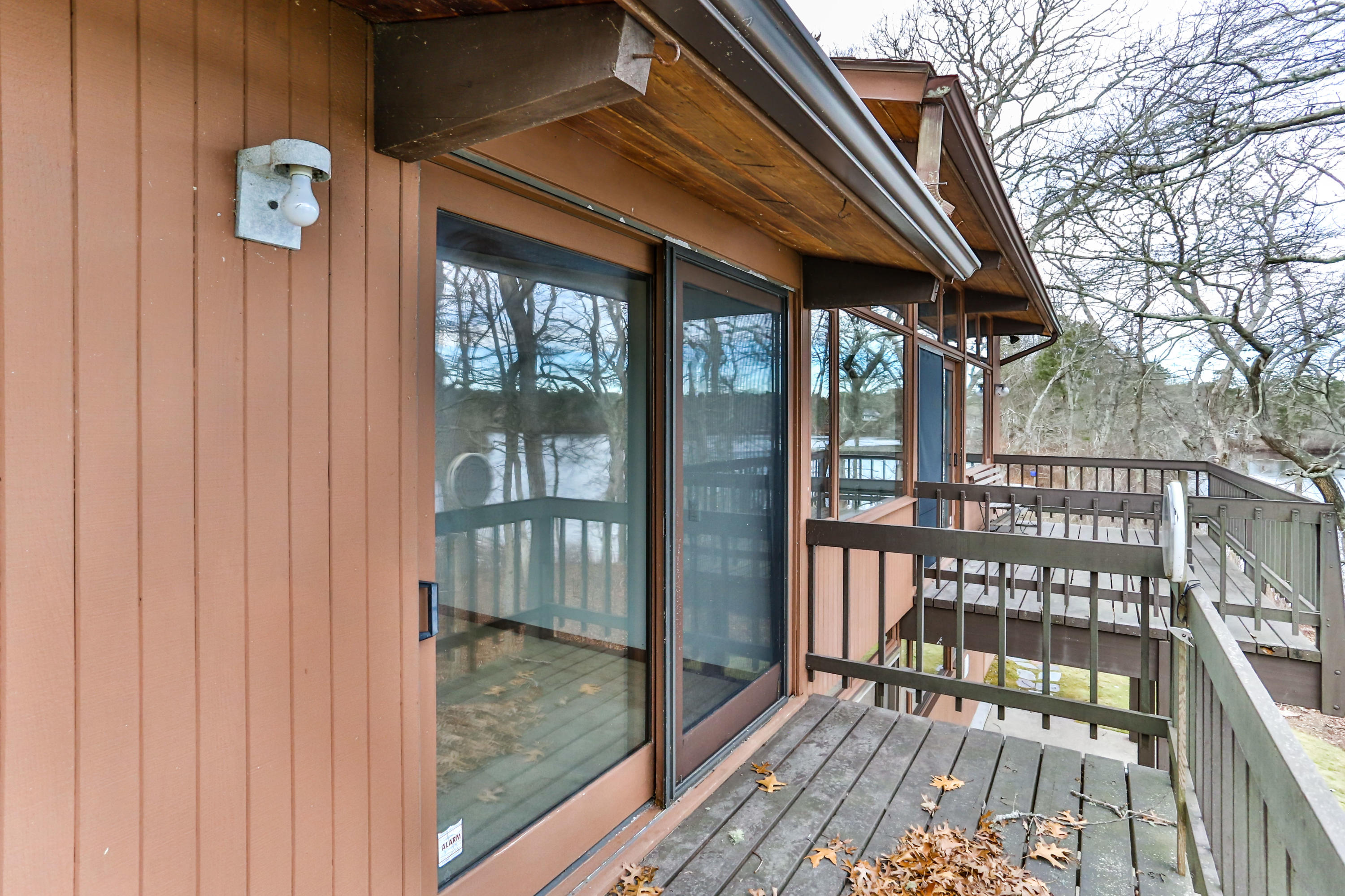 278 Huckins Neck Road Centerville, MA 02601 - Photo 29 of 52 a view of a balcony with a iron gate
