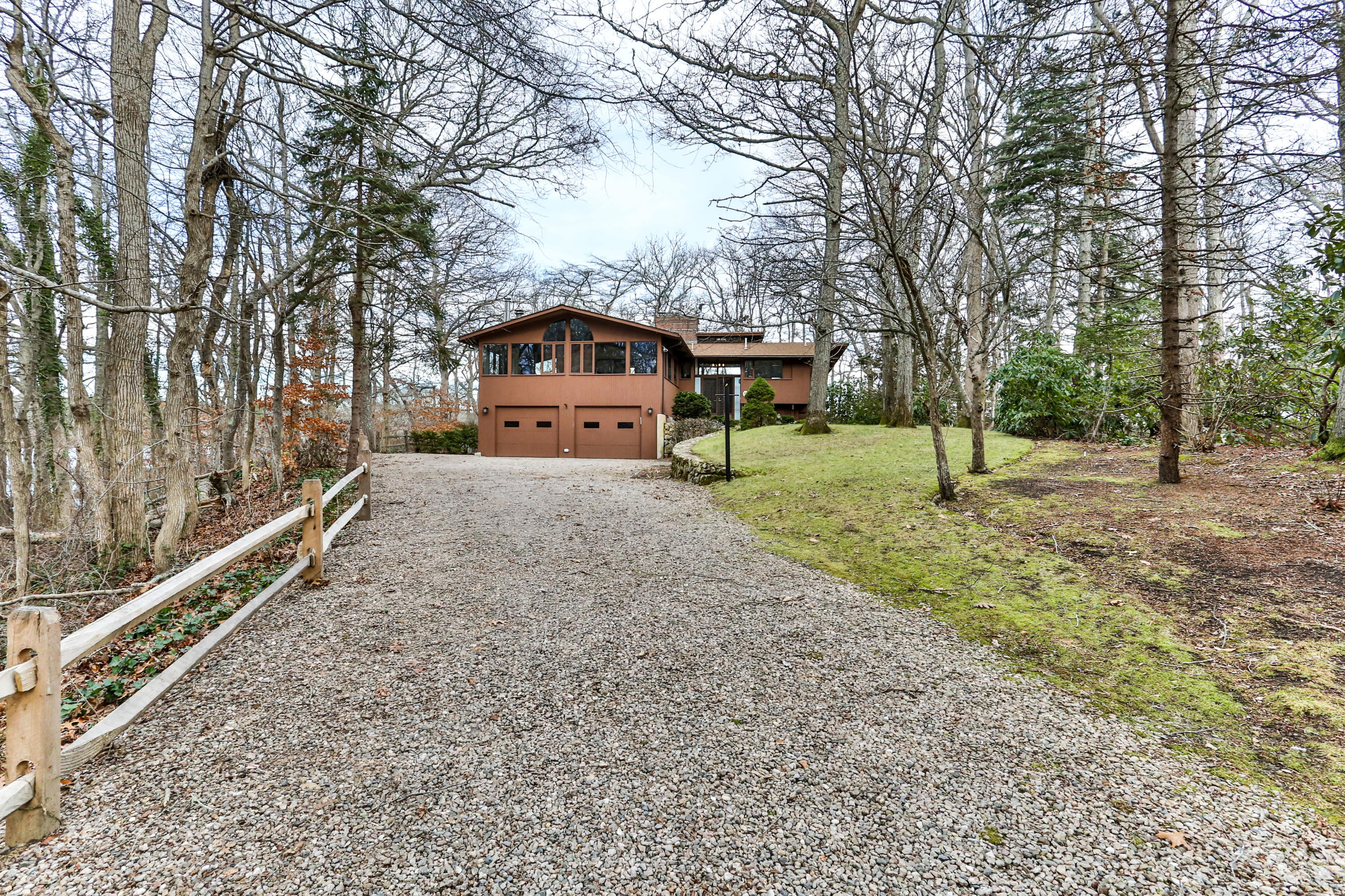 278 Huckins Neck Road Centerville, MA 02601 - Photo 3 of 52 a house with trees in front of it