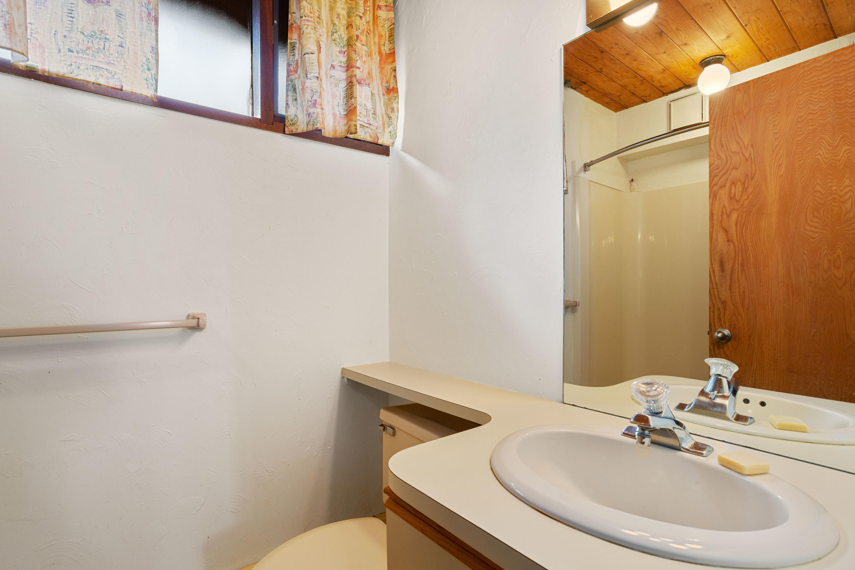 278 Huckins Neck Road Centerville, MA 02601 - Photo 42 of 52 a bathroom with a sink a mirror and a toilet