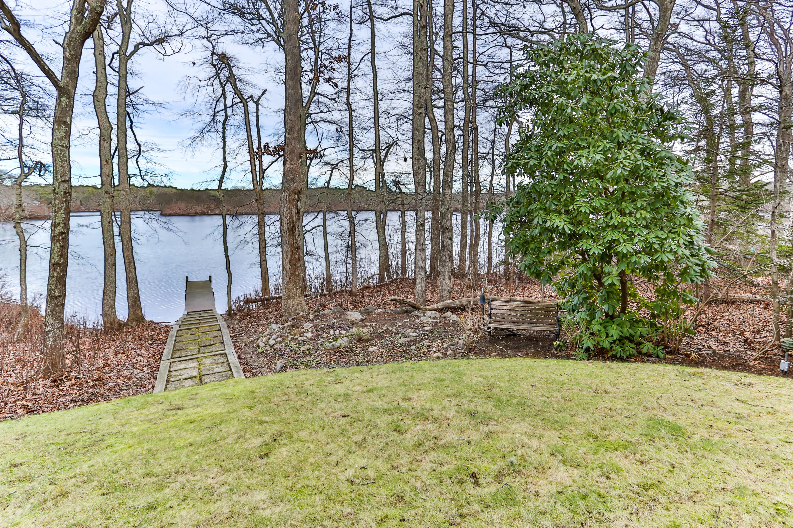 278 Huckins Neck Road Centerville, MA 02601 - Photo 48 of 52 a front view of a house with a yard