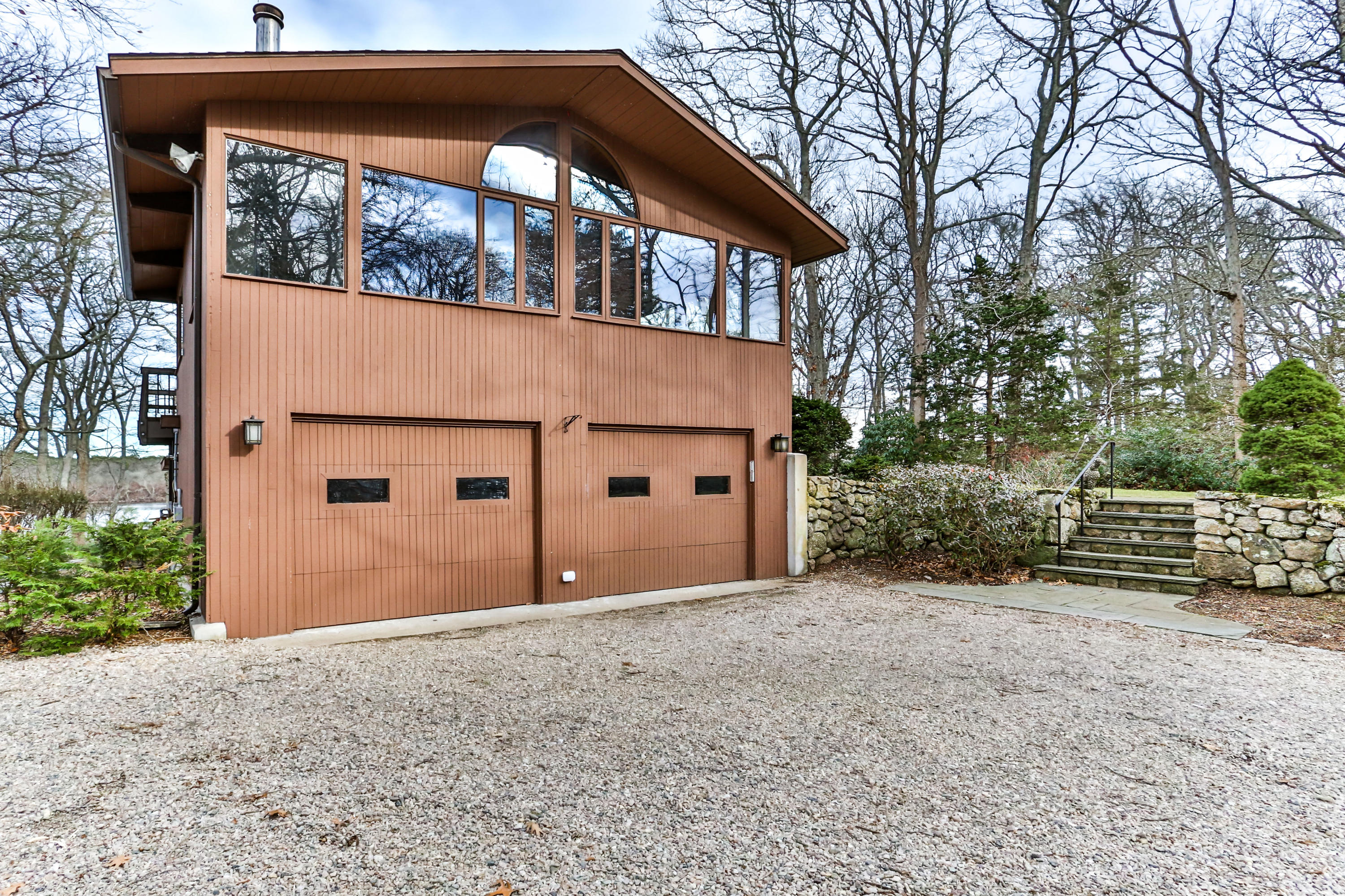 278 Huckins Neck Road Centerville, MA 02601 - Photo 5 of 52 a view of a house with a yard and garage