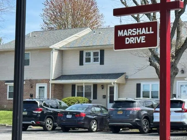 a car parked in front of a brick building