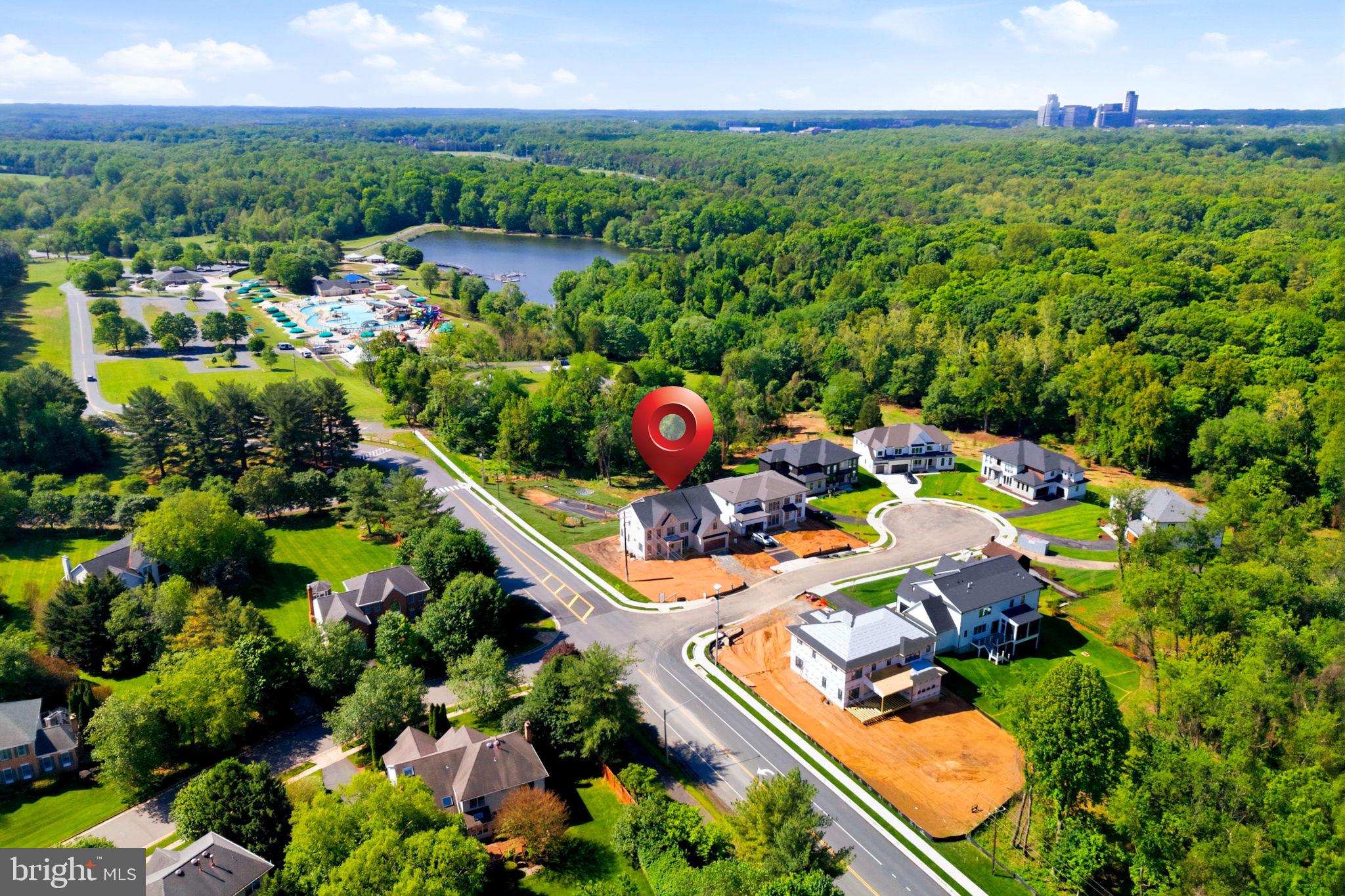 10801 Mason Hunt Court Reston, VA 20190 - Photo 14 of 26 an aerial view of a house with a garden and lake view