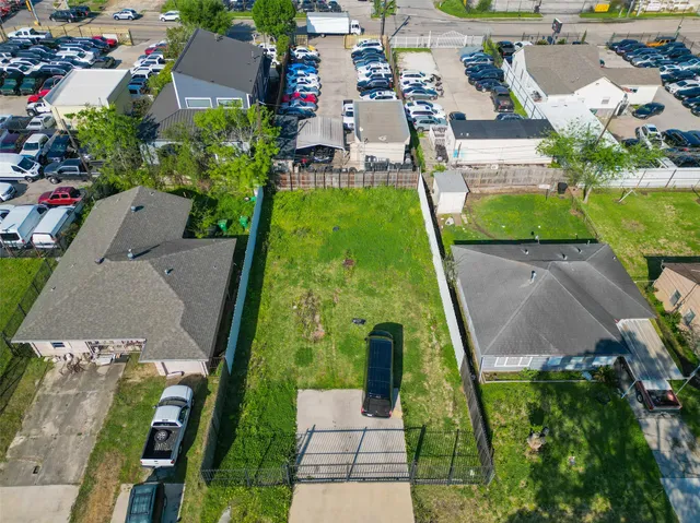 an aerial view of residential houses with outdoor space