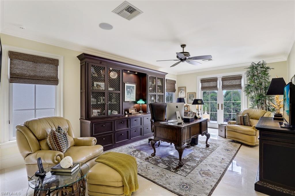 8121 Via Vecchia Naples, FL 34108 - Photo 26 of 35 a living room with furniture and a large window