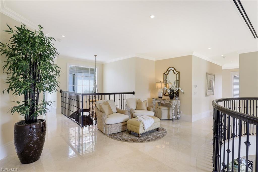 8121 Via Vecchia Naples, FL 34108 - Photo 27 of 35 a living room with furniture and a potted plant