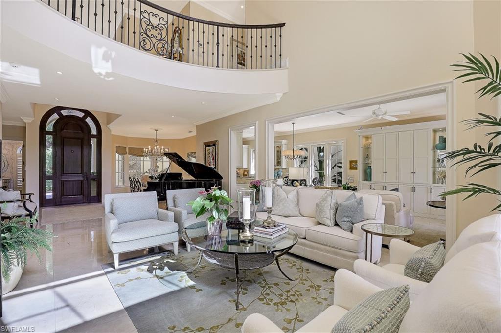 8121 Via Vecchia Naples, FL 34108 - Photo 4 of 35 a living room with furniture and wooden floor
