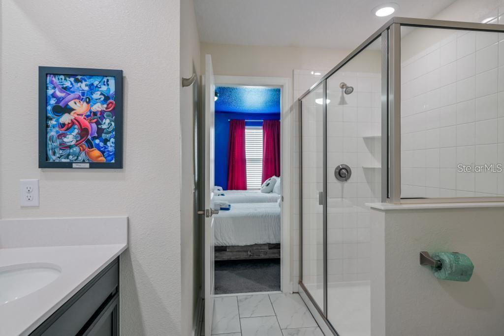 4532 Target Boulevard Kissimmee, FL 34746 - Photo 18 of 52 a en suite bathroom with a shower and a sink