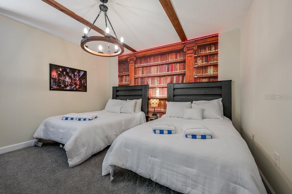 4532 Target Boulevard Kissimmee, FL 34746 - Photo 19 of 52 a bedroom with two beds and a table