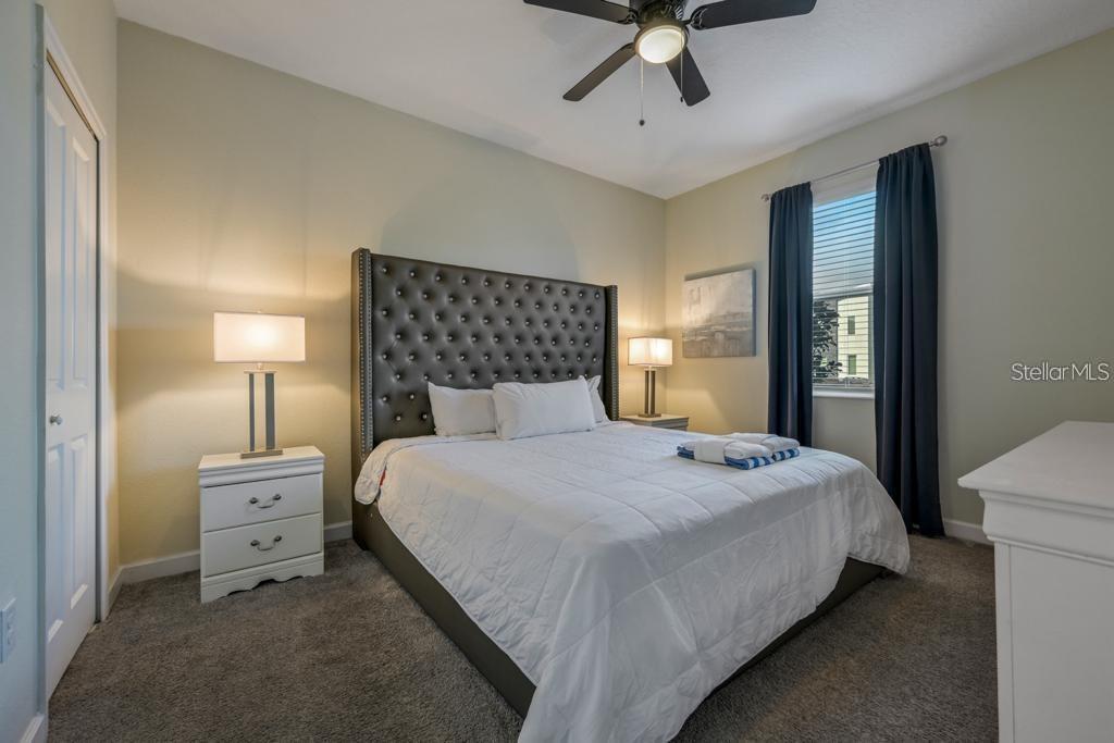 4532 Target Boulevard Kissimmee, FL 34746 - Photo 33 of 52 a bedroom with a bed and painting on the wall