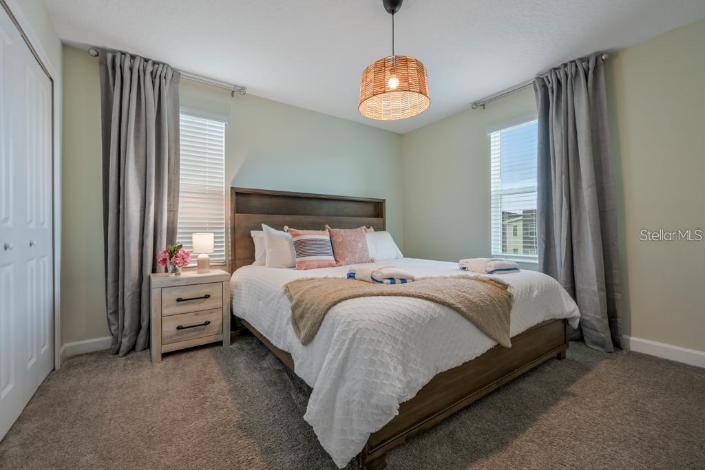 4532 Target Boulevard Kissimmee, FL 34746 - Photo 35 of 52 a bed sitting in a bedroom next to a window