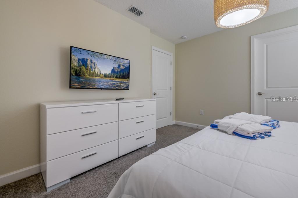 4532 Target Boulevard Kissimmee, FL 34746 - Photo 43 of 52 a bedroom with a bed and a window
