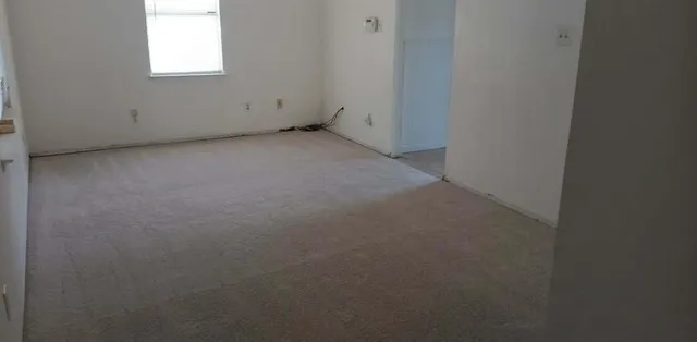 a view of a window in an empty room