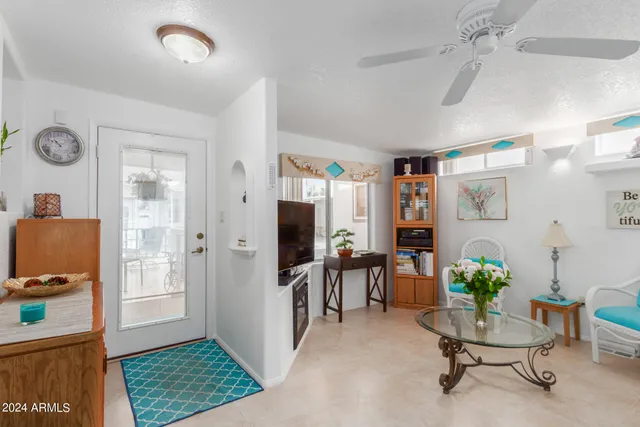 a living room with furniture and a window