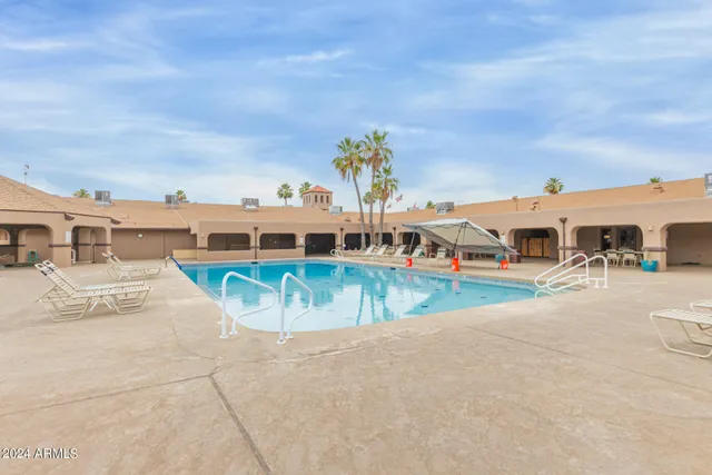 a aerial view of a house with a yard and potted plants