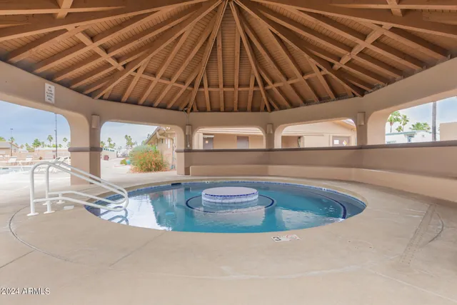 a kitchen with a table and chairs