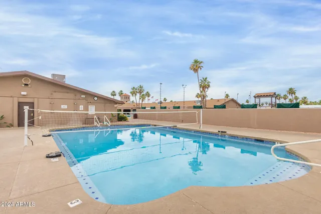 a living room with furniture and large window