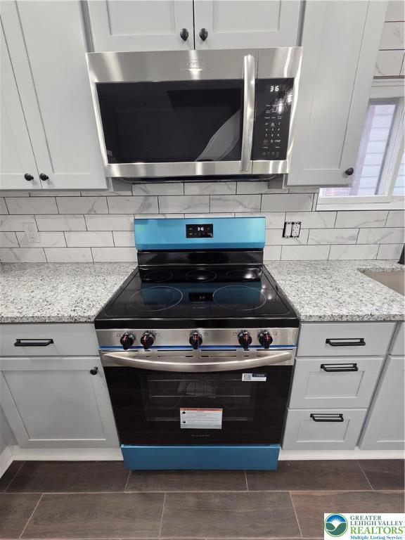 253 East Abbott Street Lansford, PA 18232 - Photo 11 of 43 a stove top oven sitting inside of a kitchen