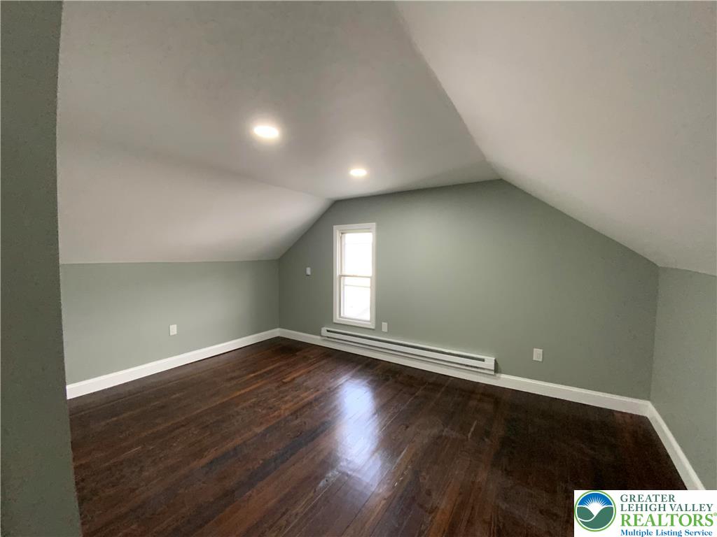 253 East Abbott Street Lansford, PA 18232 - Photo 21 of 43 an empty room with wooden floor and windows